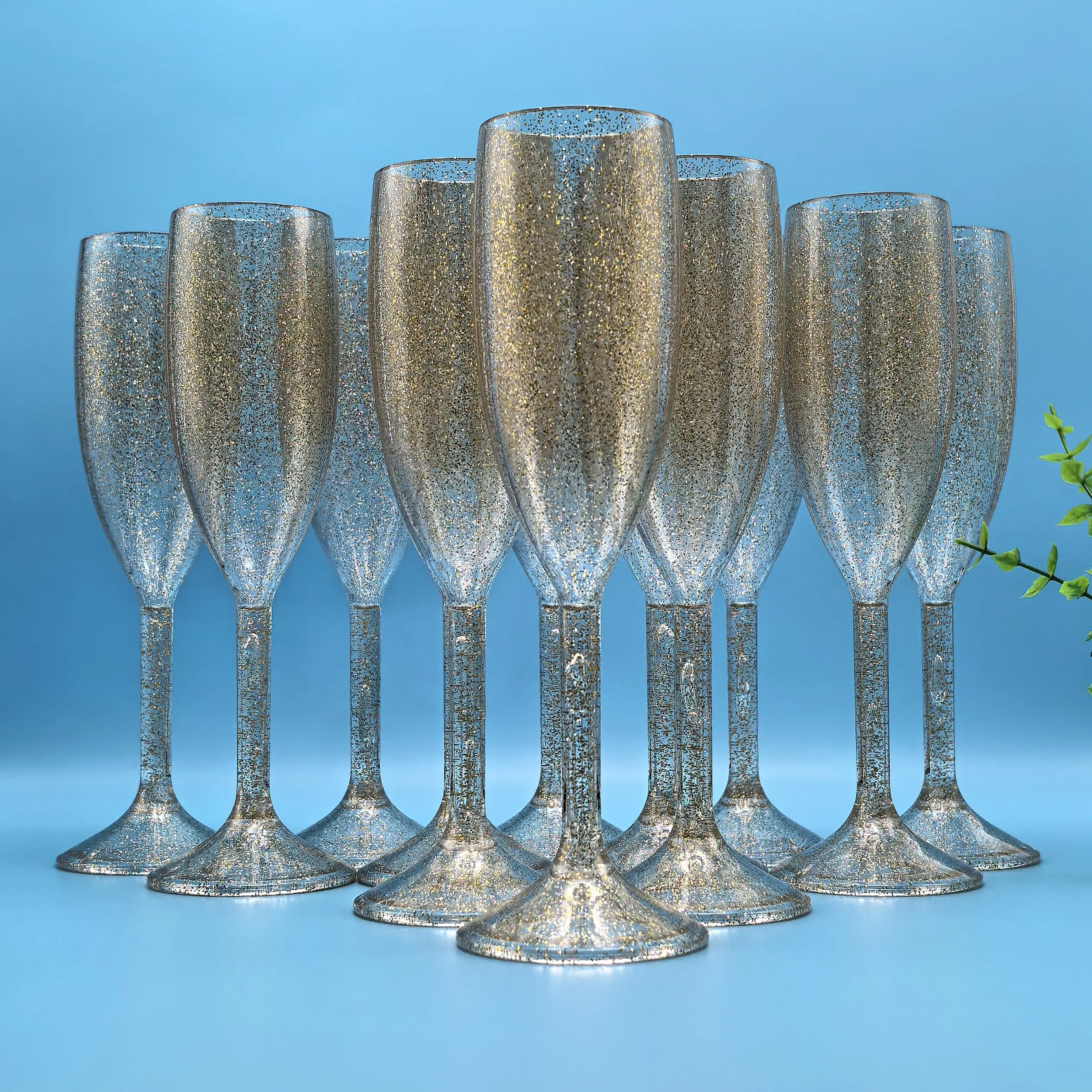 

Elegant sparkling gold champagne flutes, flute glasses lined up with tall stemmed wine glasses