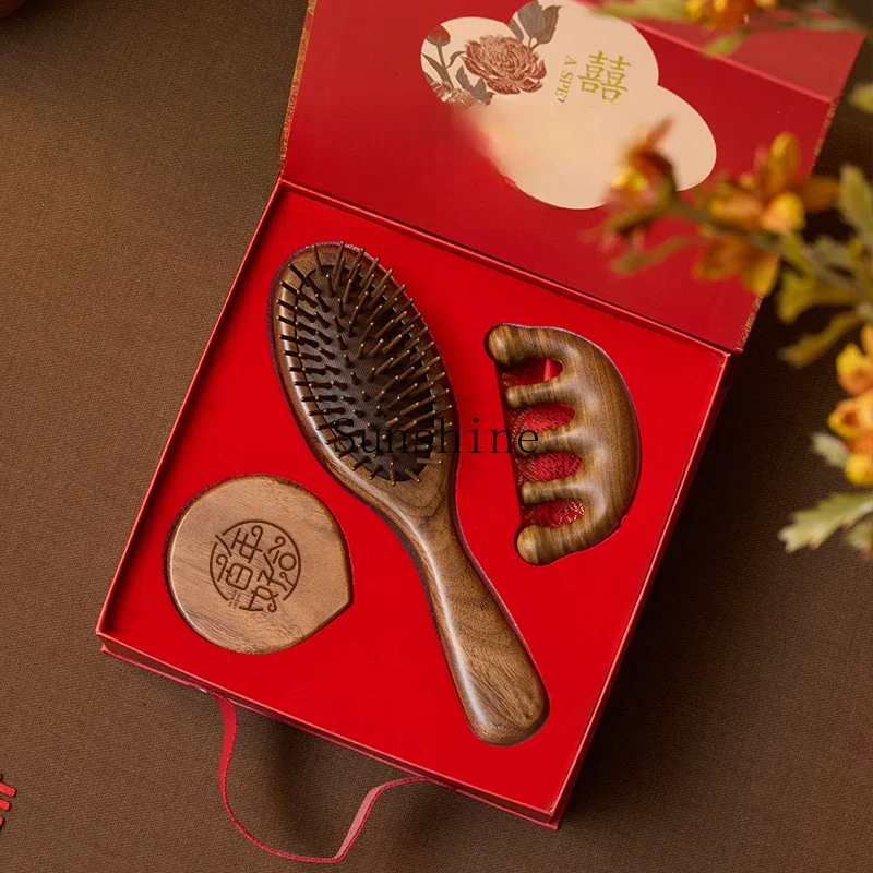 A pair of black walnut combs as a wedding gift