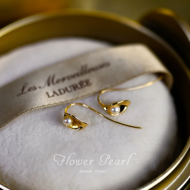 In 2024 The New Calla Lily Pearl Earring Hook Port Wind French Temperament Net Red Earring Female Retro Personality Senior Sense
