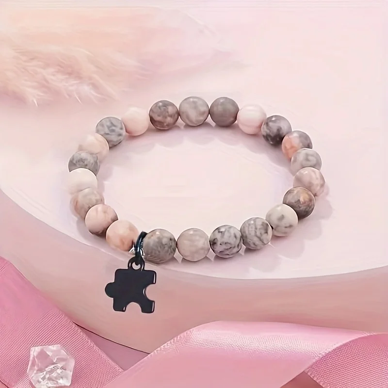 A pink zebra natural stone jigsaw bracelet with adjustable elastic cord pendant bracelet