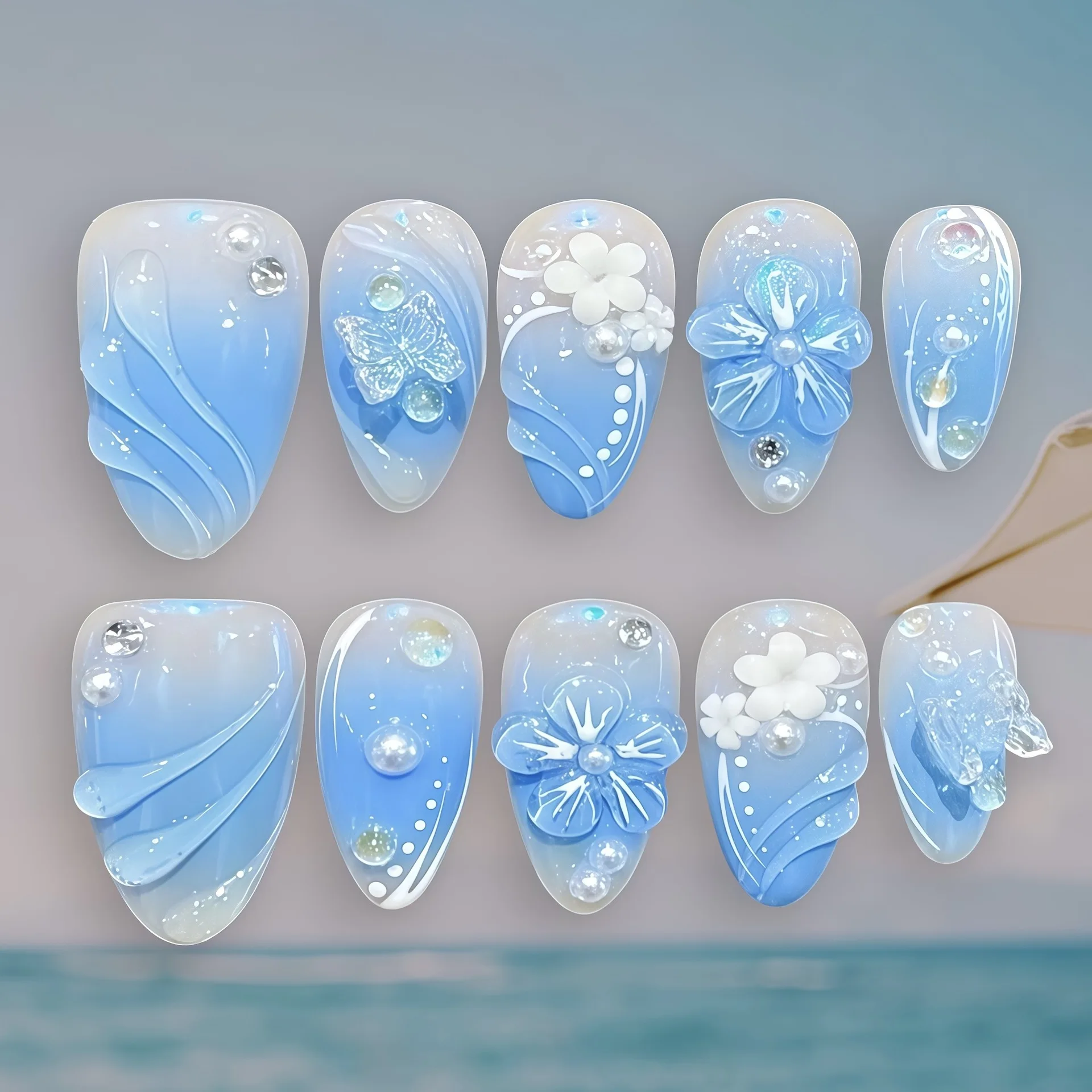 

24PCS Blue Gradient Ocean Press on Nails 3D Flower Butterfly False Nails with Pearl and Rhinestone Decor Almond Acrylic Nail Tip