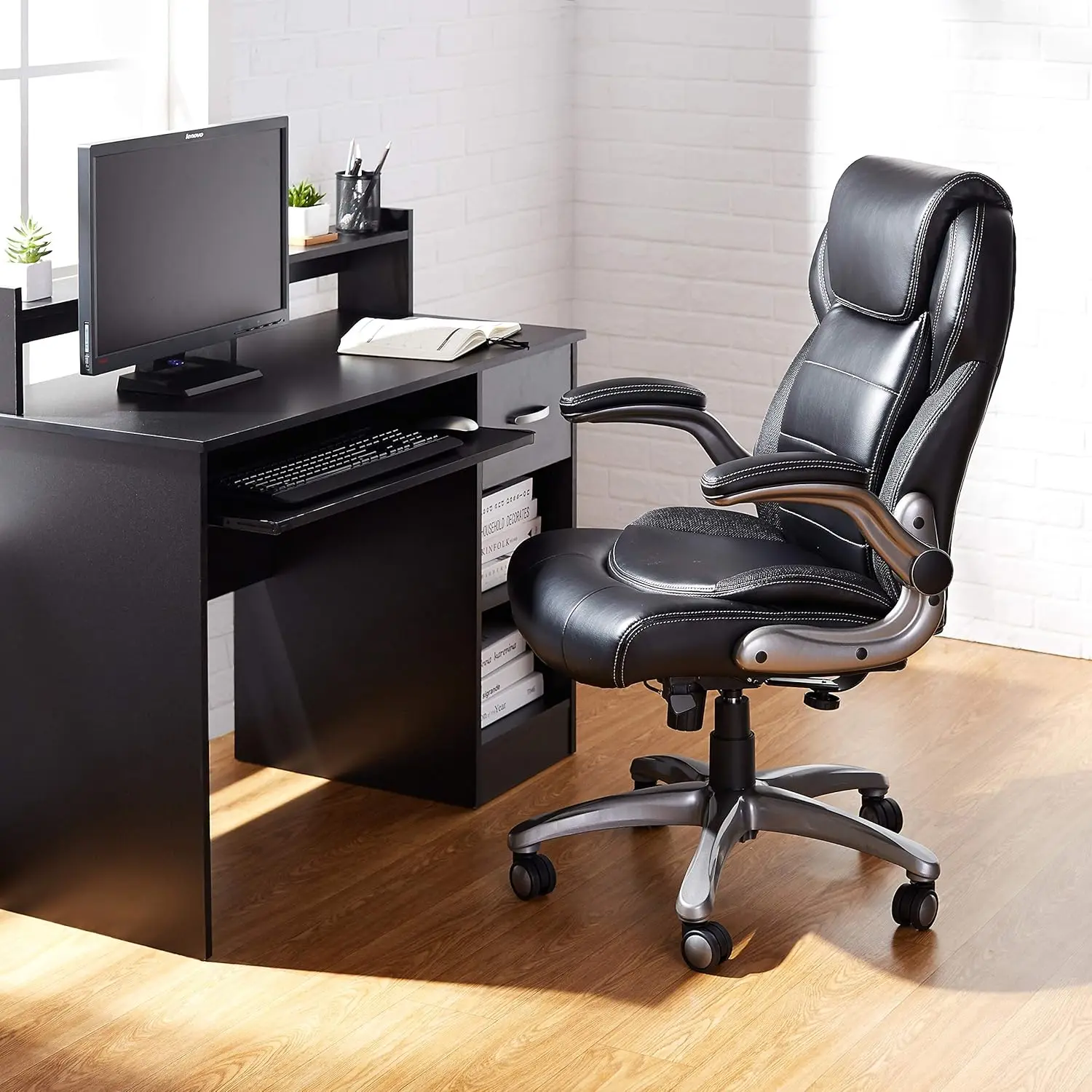 mazon Basics Ergonomic Office Chair, High-Back Bonded Leather with Flip-Up Arms and Lumbar Support, Black, 29.5