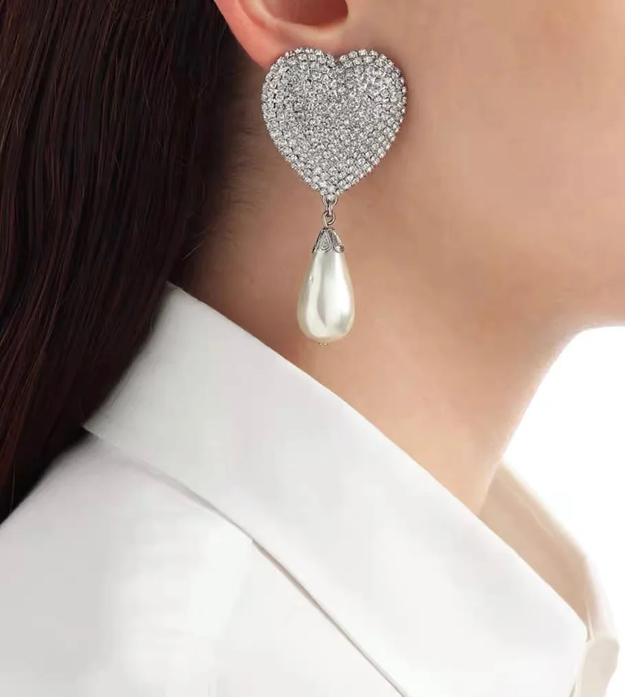 Orecchini cuore Qi qualità luce moda di lusso per le donne Aretes De Mujer Pendientes Boucle D'Oreille Orecchini Clip De Oreja