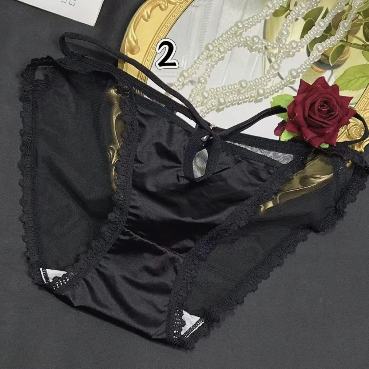 Ropa interior sexy de encaje negro para mujer, pantalones triangulares huecos sexys de satén