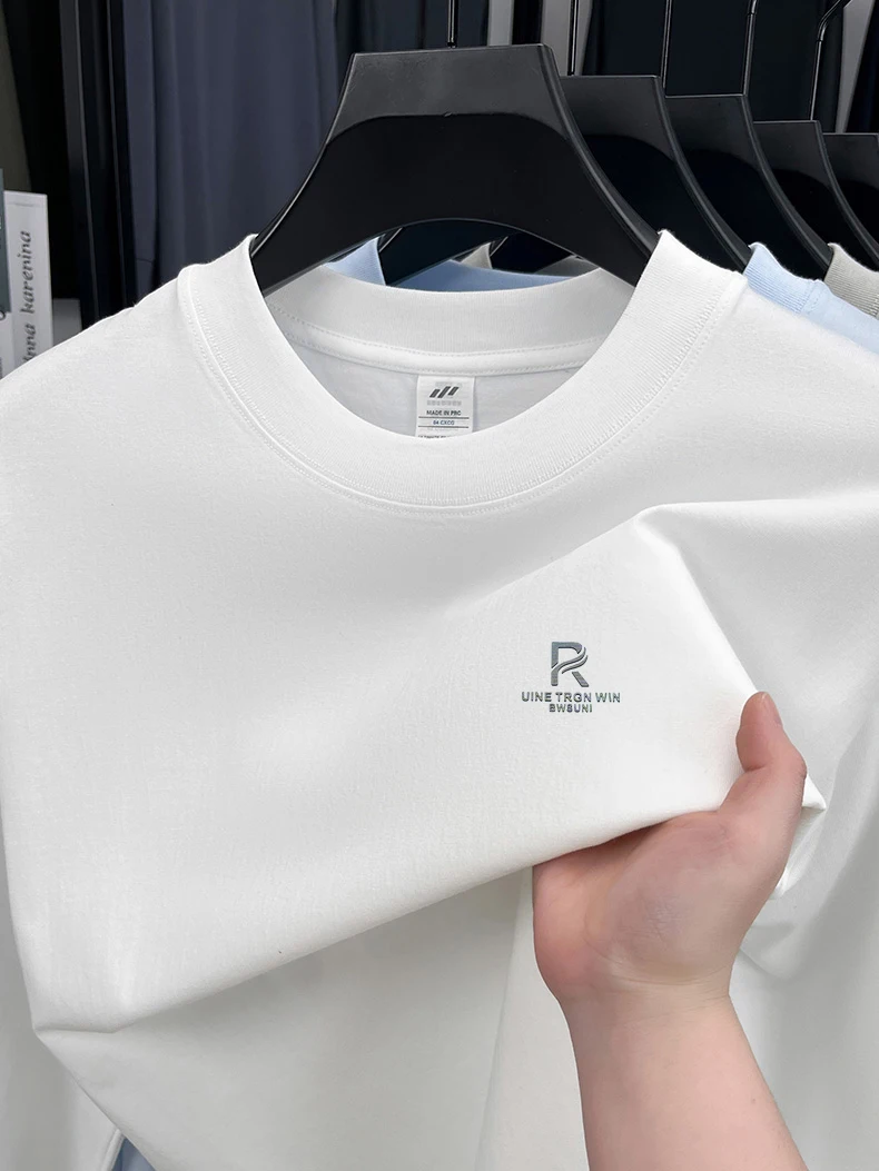 T-shirt a maniche lunghe da uomo in puro cotone di fascia alta 2025 Nuova primavera e autunno inverno girocollo allentato con cappuccio tinta unita da uomo