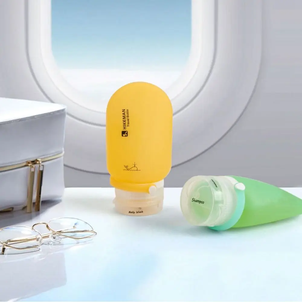 Novo portátil cosméticos viagem de acampamento garrafa dividida 60ml plástico viagem recarregável kit garrafa de silicone à prova de vazamento garrafa recarregável