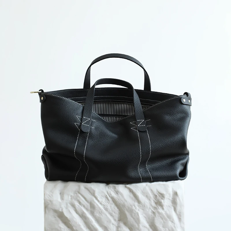 

Top layer cowhide oversized tote bag 2025 new niche design minimalist leather large capacity tote bag fashionable ladies handbag