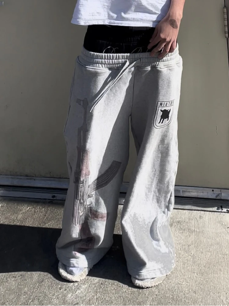 Graue, sprühbedruckte Hose mit Reißverschluss und Kordelzug, bodenlange Freizeithose, kurze Streetstyle-Hose für Herren und Damen