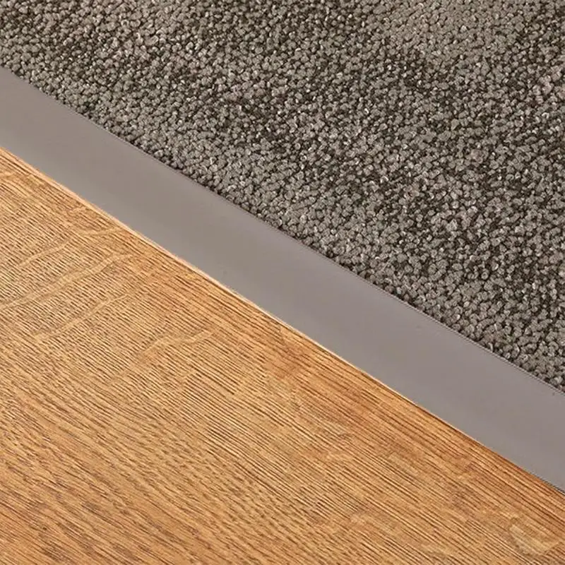 Tira divisora de suelo, tira de cubierta de suelo laminado plano, cubierta de suelo impermeable, tira de unión para unir huecos de suelo, alfombra