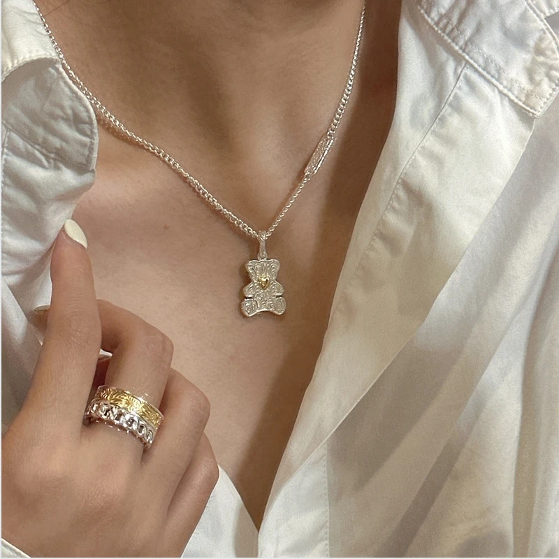 S925 pure silver Korean edition niche design with Tang grass texture and gold silver contrasting color bear pendant, Korean styl