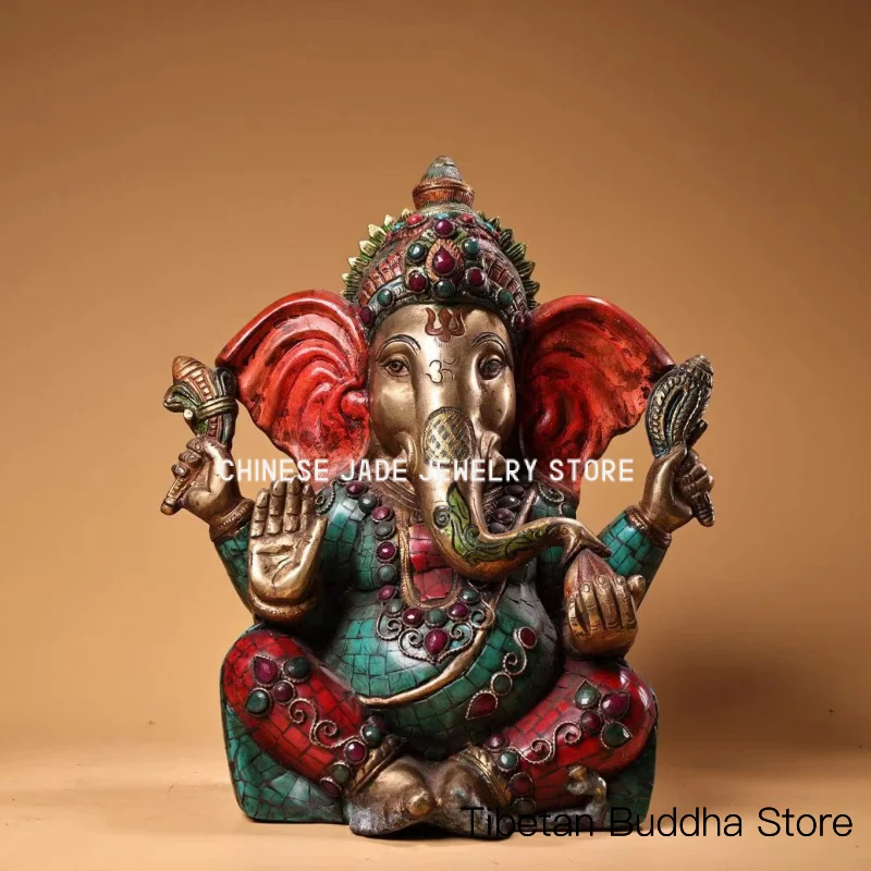 An antique Tibetan bronze-cast Buddhist statue, hand-painted with traditional Tibetan craftsmanship and inlaid with precious sto