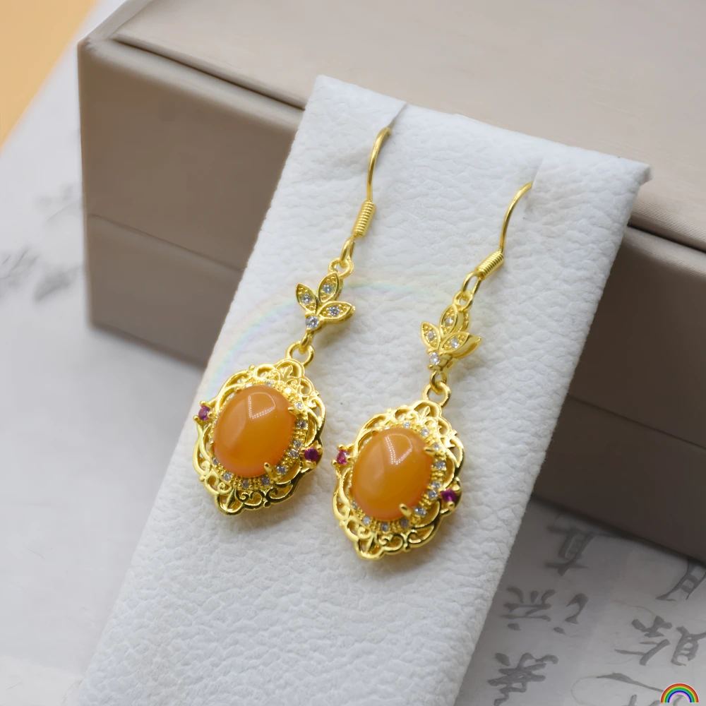 

Natural beeswax earrings for women, chicken oil yellow amber retro court style hollow out light luxury gemstone earrings Rwbuye