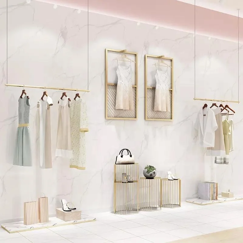 Custom, luxury high end retail store fixture hanging clothing store furniture custom shop design metal gold clothing dress displ