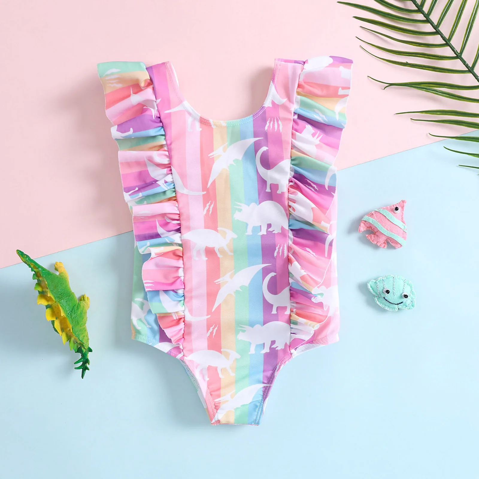 Toddler one piece swimsuit with ruffle and rainbow vertical stripe white dinosaur silhouette pattern for beach and pool water pl