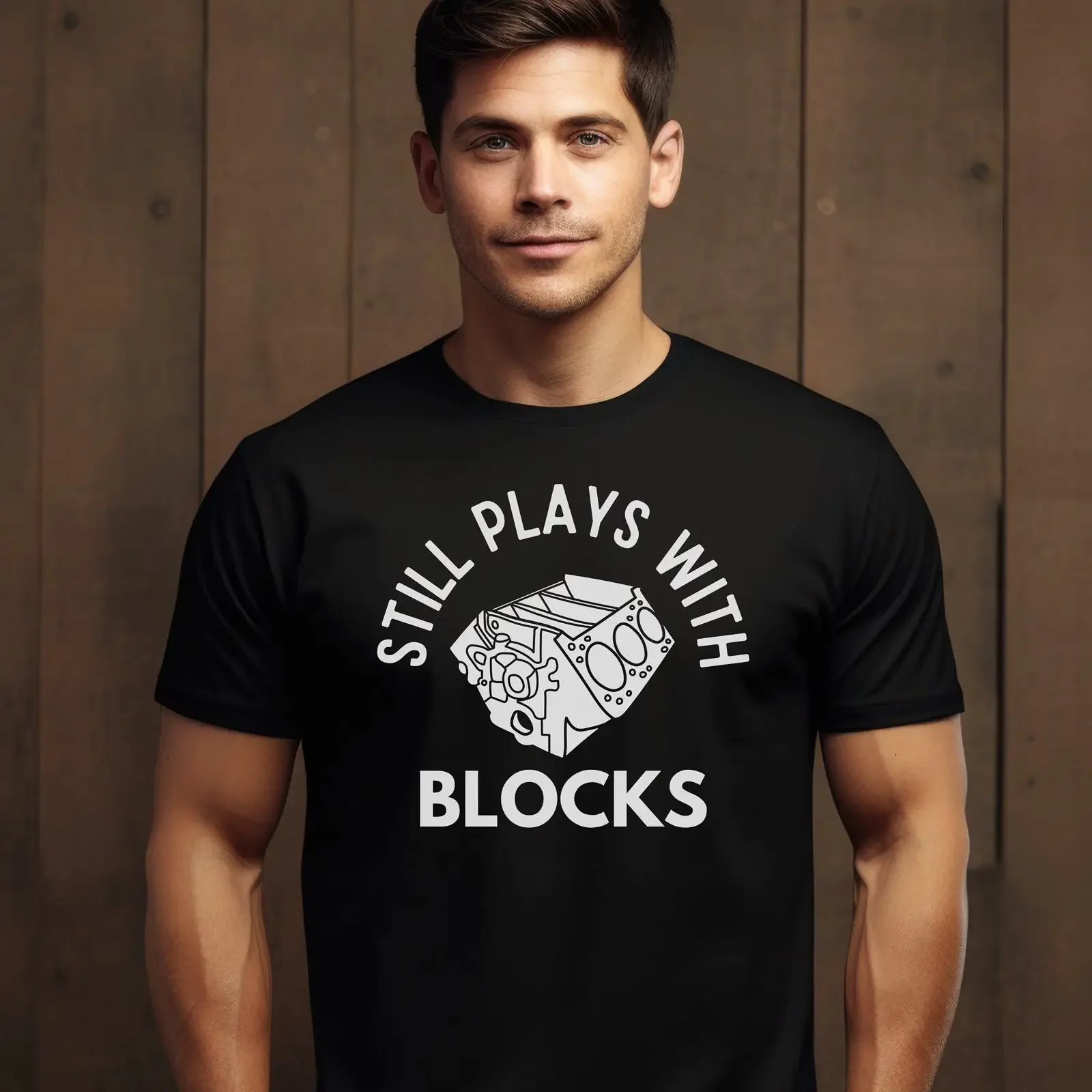 May include Black t shirt with a white graphic of an engine block and the text Still Plays Blocks vintage Washed streetwear