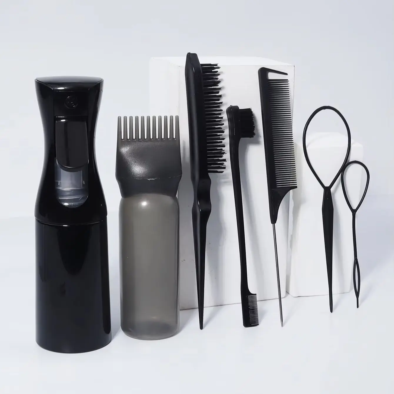 

7-piece hairstyle set, equipped with hair rings, spray bottle and wash bottle, edge brush and pointed tail comb