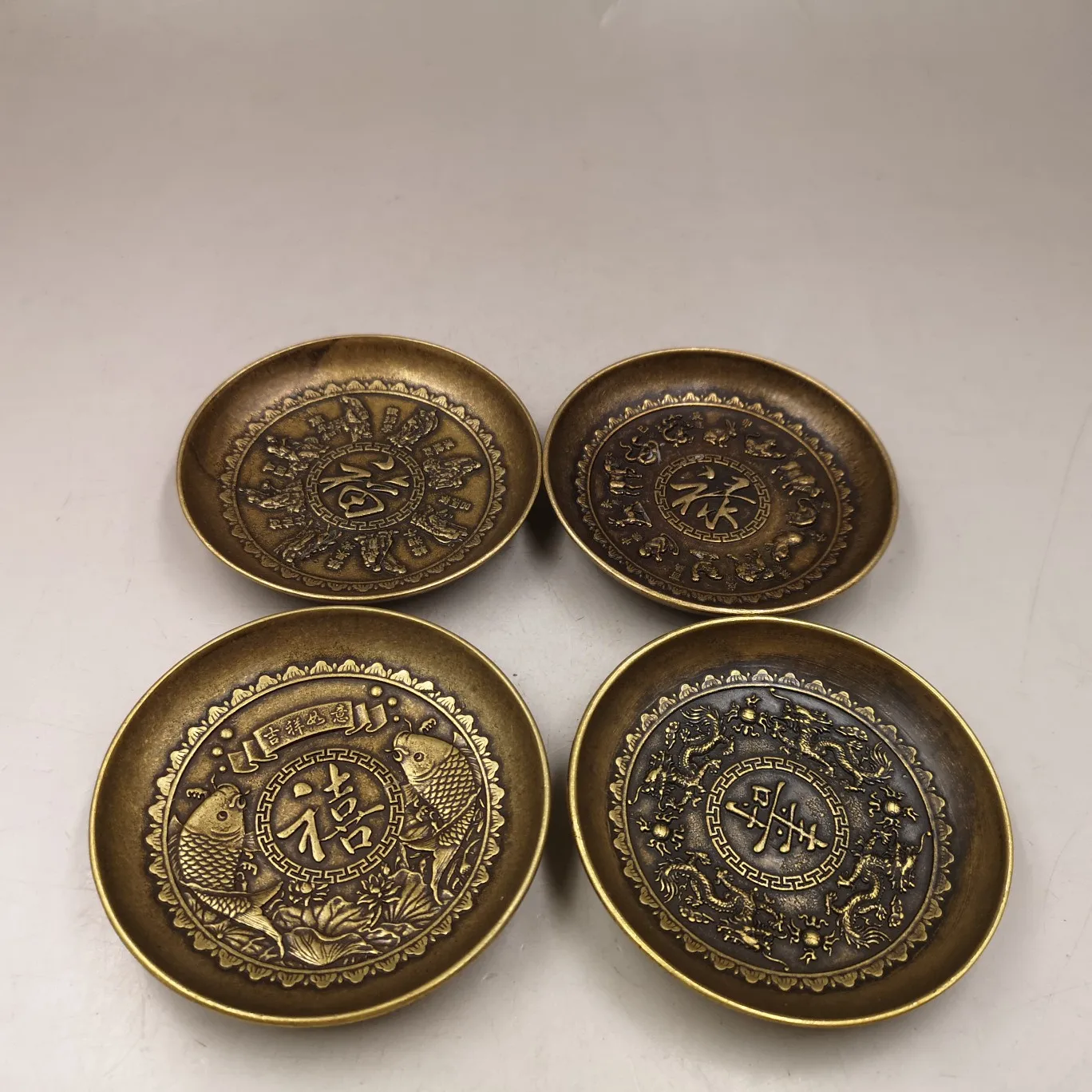 

A set of home decorations collection handicrafts, including brass, fortune longevity character patterned plates