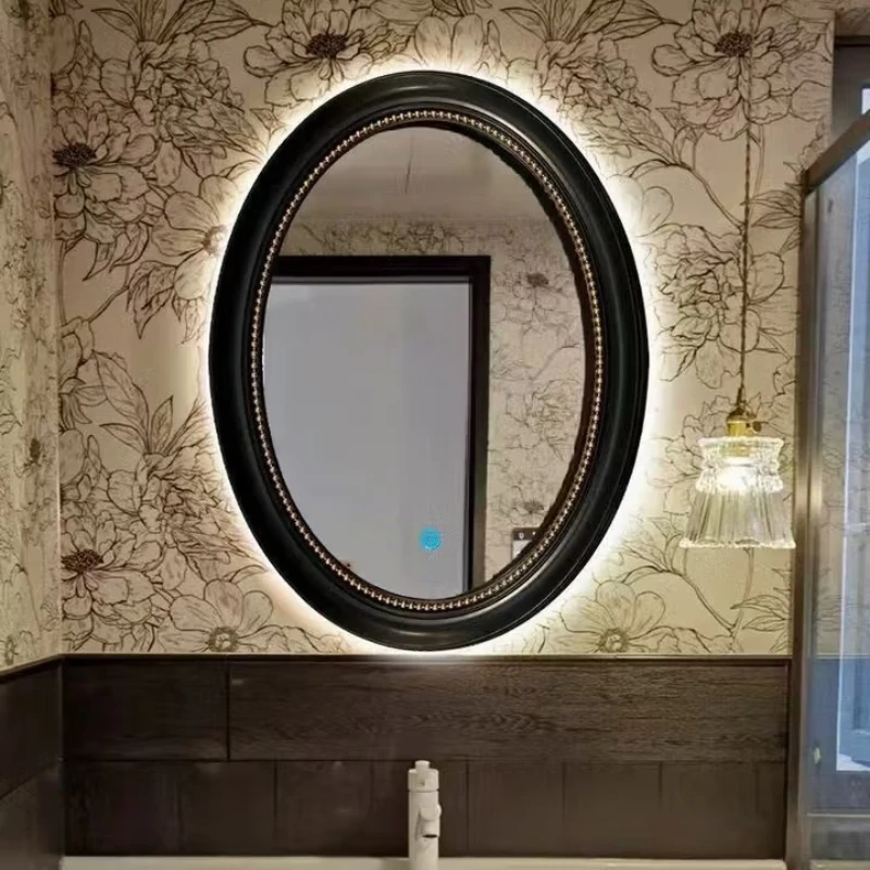 

Vintage French oval, black antique bathroom mirror