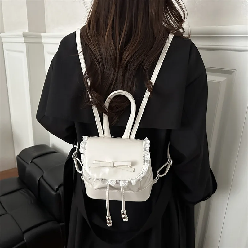 حقيبة ظهر نسائية كرتونية بسيطة للترفيه حقيبة مدرسية على طراز الباليه حقيبة دلو صغيرة مريحة ومتعددة الاستخدامات مع دانتيل على شكل فيونكة