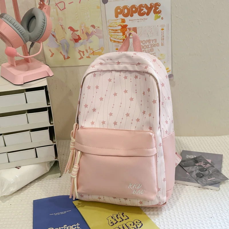 

Fresh and stylish Korean-style star backpack for female middle school students, attractive printed lightweight waterproof backpa