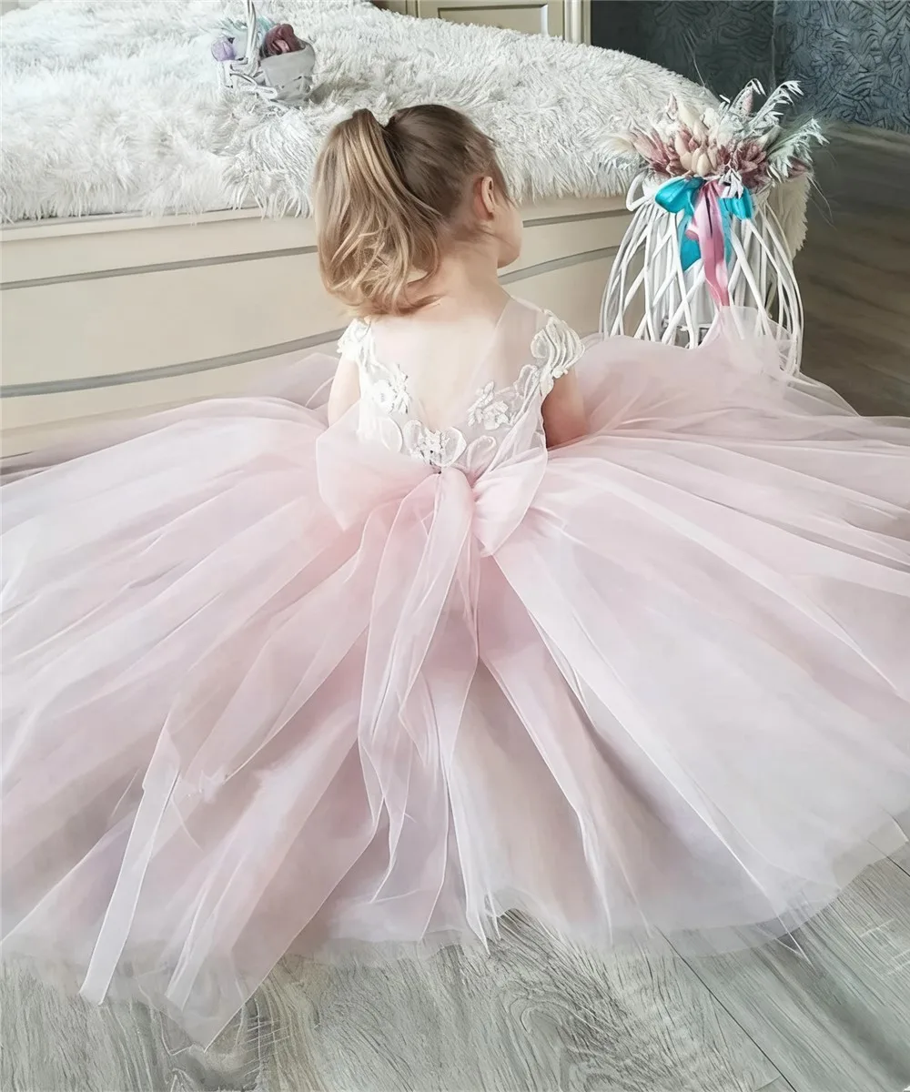 فساتين فتاة الزهور الوردية المخصصة من التول مع فيونكة بدون أكمام لحفلات الزفاف وأعياد الميلاد وحفلات التواصل الأول