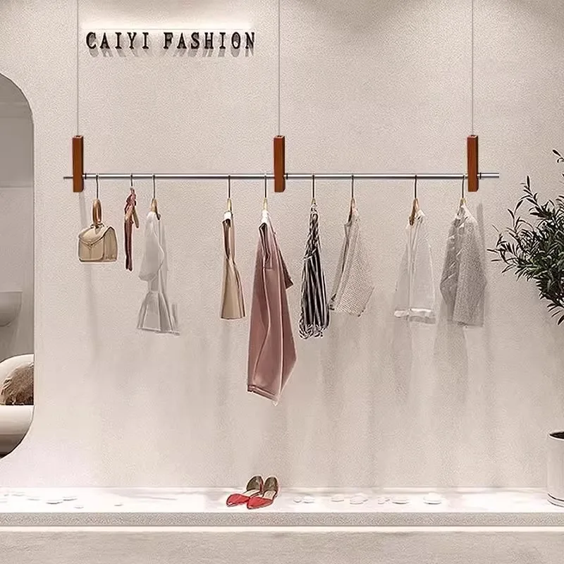presentoir-de-magasin-de-vetements-en-acier-inoxydable-cintre-couleur-grain-de-bois-decoration-de-magasin-style-brique-et-mortier-robe-de-mariee