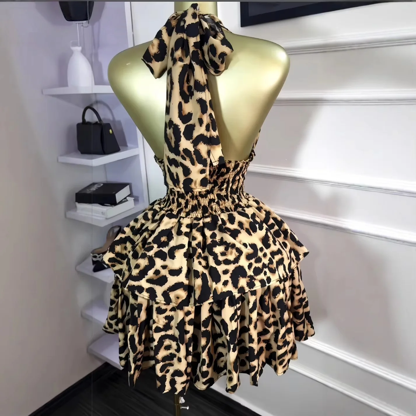 Ruffle party dress with sleeveless halter top, backless shape, and mini length