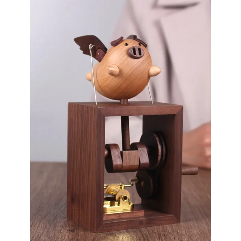 Wooden hand-cranked music box, high-end cartoon flying pig ornament, Valentine's Day birthday gift.