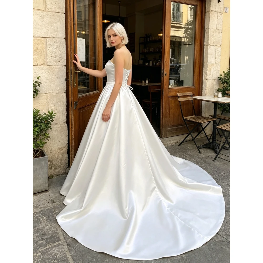 Customized Luxury Strapless Satin White Wedding Dresses 2026 New Backless Pleated Fluffy Bridal Gown Suitable for The Beach