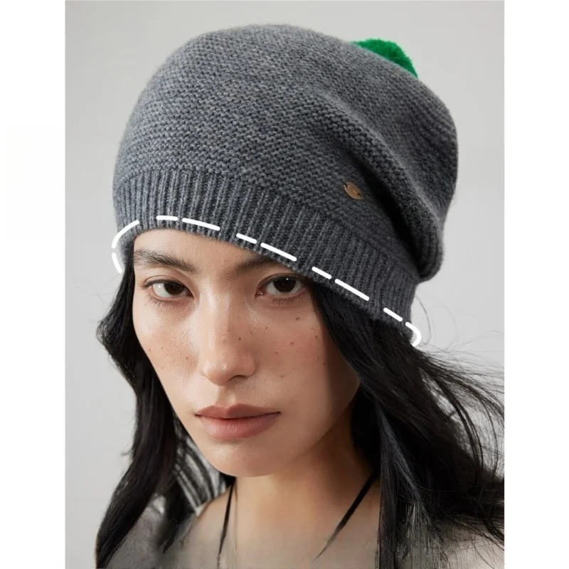 

A light grayish-green youthful knitted beret pile cap girl