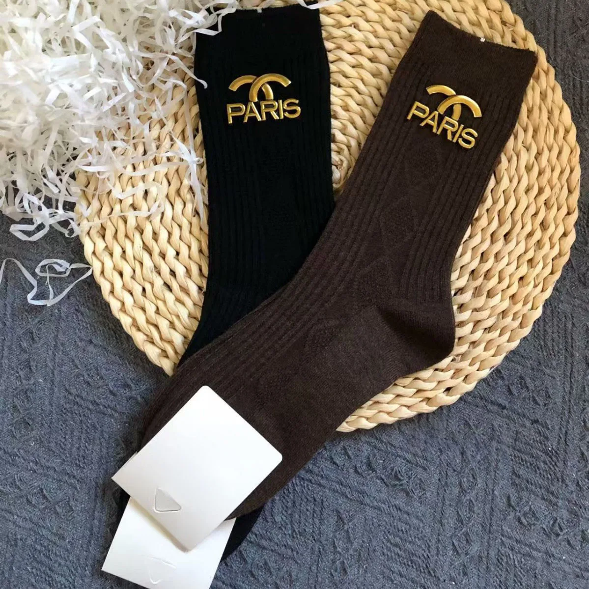

2 pairs set. Designer style. Autumn-winter thick wool socks in brown and black. Outerwear with metal accessories. High-top socks