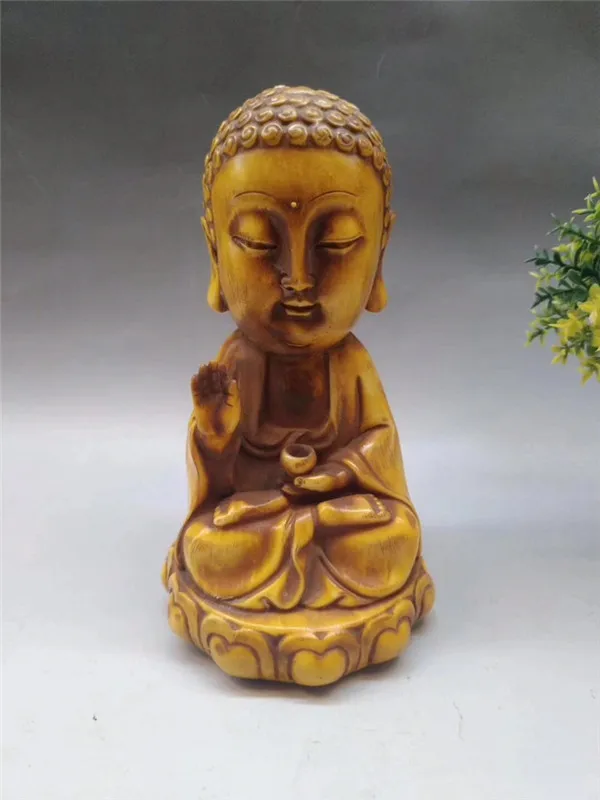 Handicraft Bone Carving 19031 Lotus Sakyamuni is 8 wide and 14.5 cm high and weighs 610 grams.