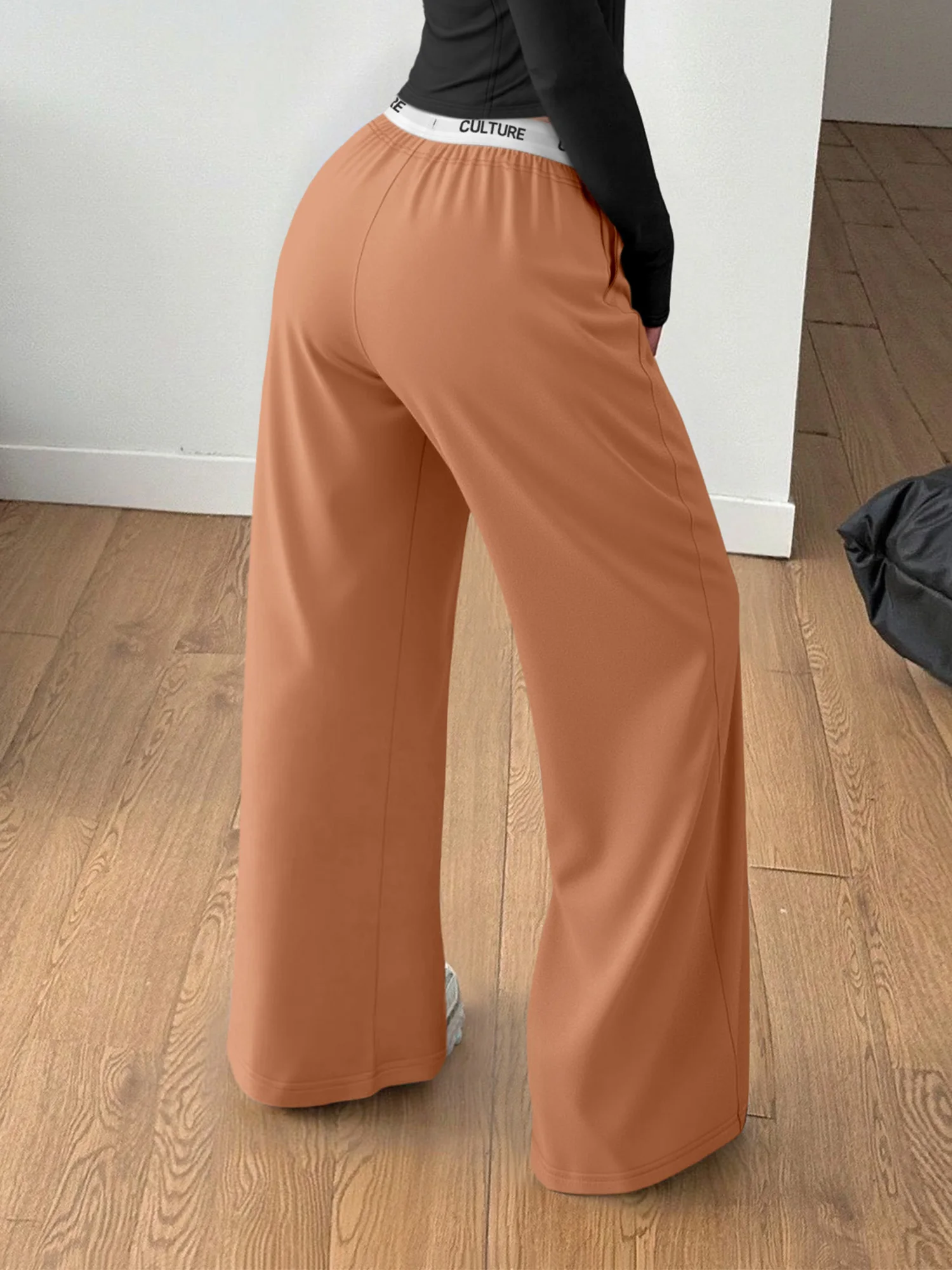 Zwarte loungebroek met wijde pijpen voor dames, ontspannen pasvorm, "CULTUUR" tailleband, zachte casual broek