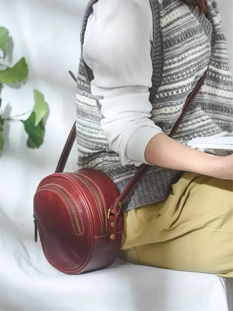 

PNDME casual designer genuine leather ladies round crossbody bag simple high quality natural real cow leather women shoulder bag