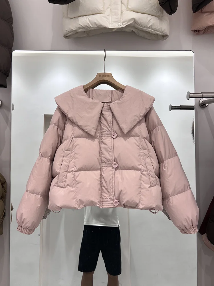 سترة ذات ياقة دمية بلون سادة للنساء 2025 النسخة الكورية الجديدة سترة قصيرة غير رسمية بتصميم بطة بيضاء عصرية