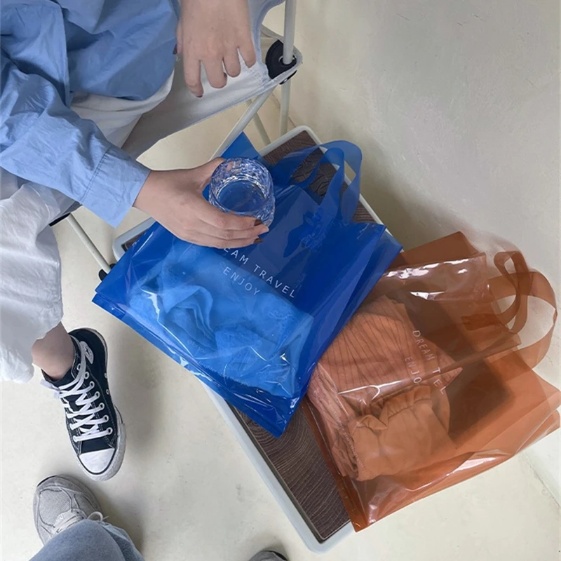 StoBag 50pcs Transparent Plastic Woman Shopping Shoulder Tote Bags Clothing Gift Packaging Big Portable Reusable Logo Wholesale