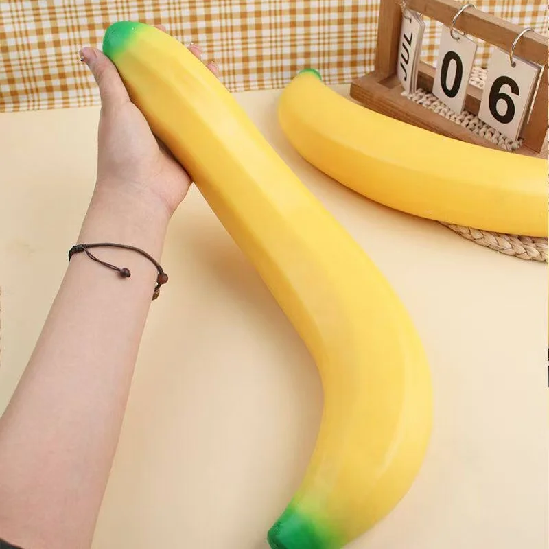 

Giant Banana Squishy Toy Fake Banana Squeeze Toy Squishy Stress Relief Fidget Toy Slow Rising Desk Accessory for Adults Gifts