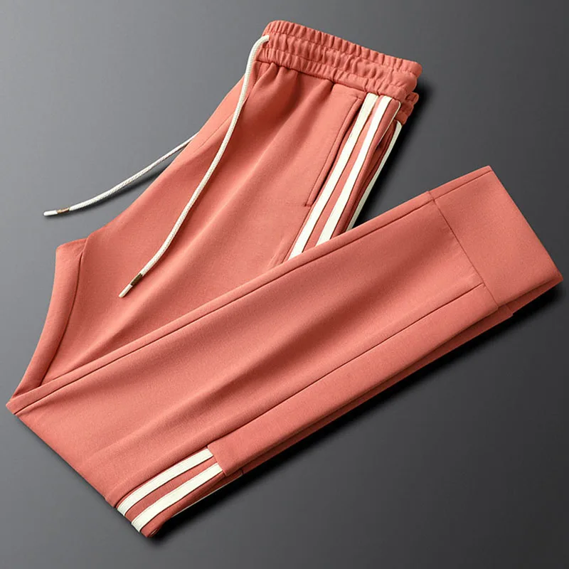 Wear light luxury with grapefruit red side striped casual sports pants autumn and winter slim men and women with the same sweatp