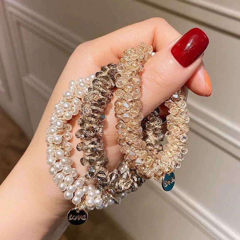 Bando mutiara versi Korea, gelang temperamen sederhana penggunaan ganda pita karet kristal ikat kepala manis Aksesori rambut