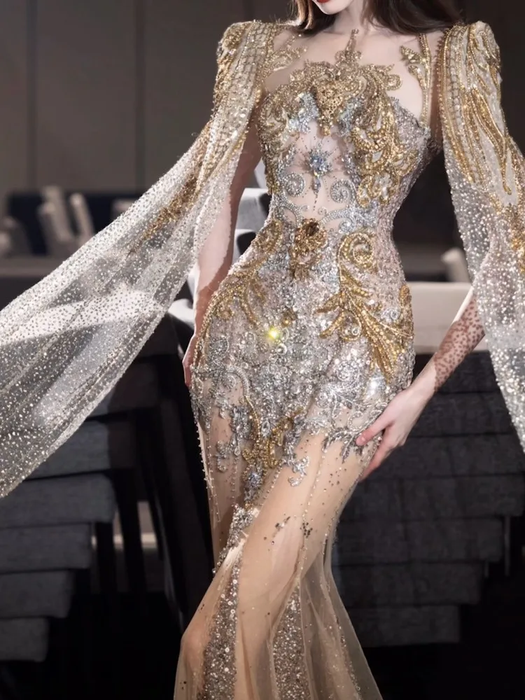 The light gold host's beaded toasting party will show off shawl dress