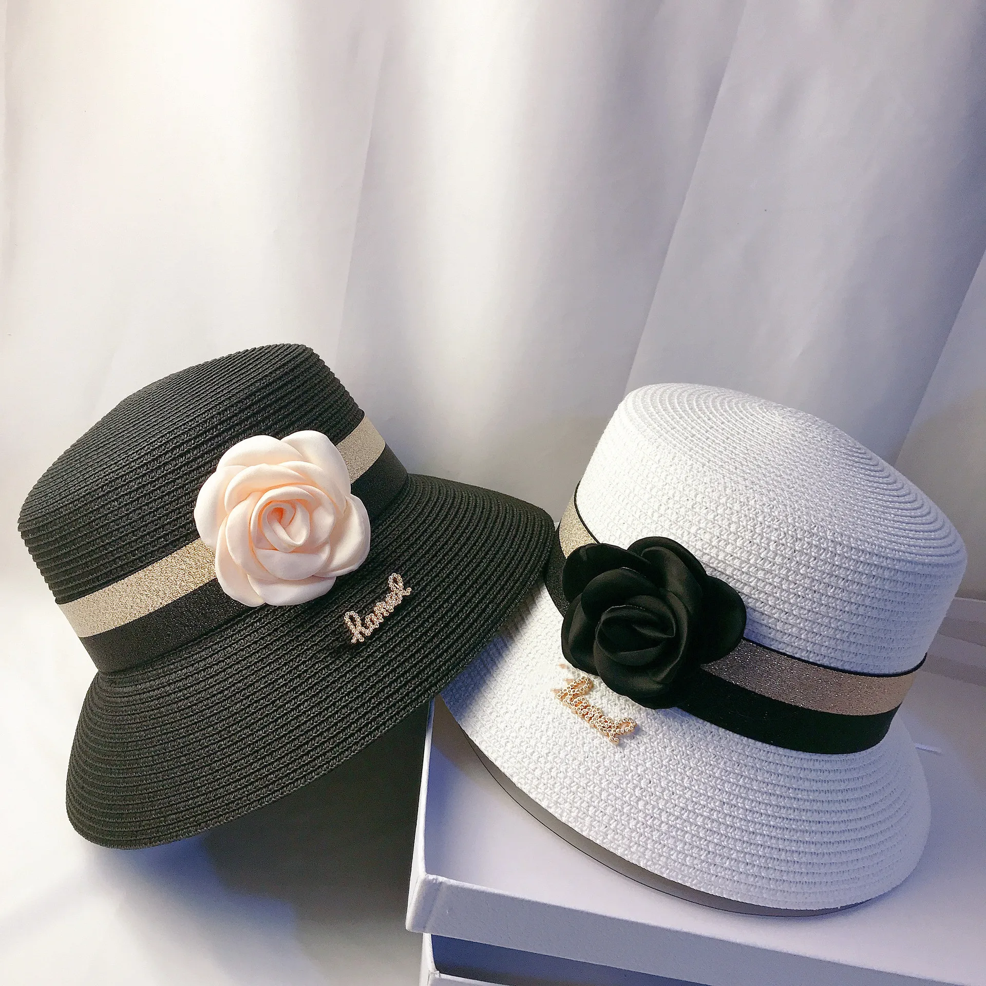 

Summer new small fragrant wind ribbon oblique brim sun hat female star all-match UV protection pot hat