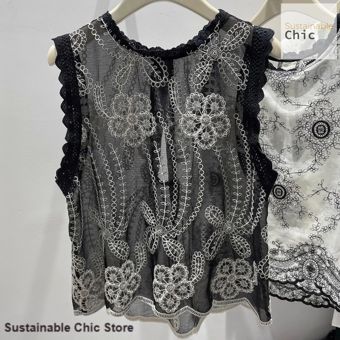 Summer new fashion western lace crochet openwork stitching sleeveless shirt female Korean loose slim vintage printed blouse.