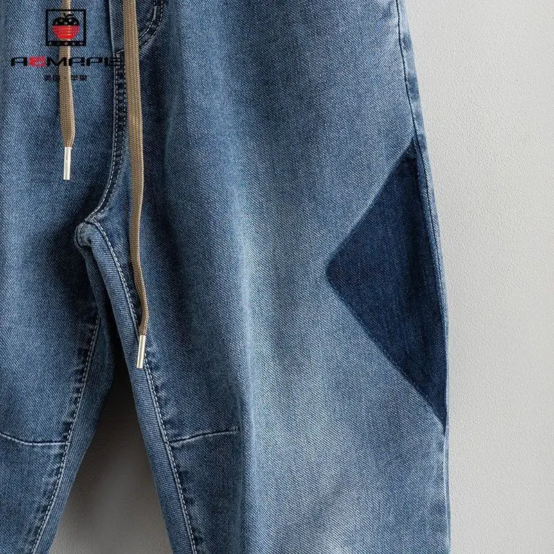 Ropa de calle de diseñador holgada para hombre, pantalones vaqueros bombachos sueltos con cordón, estilo Hip Hop, informal, primavera y otoño