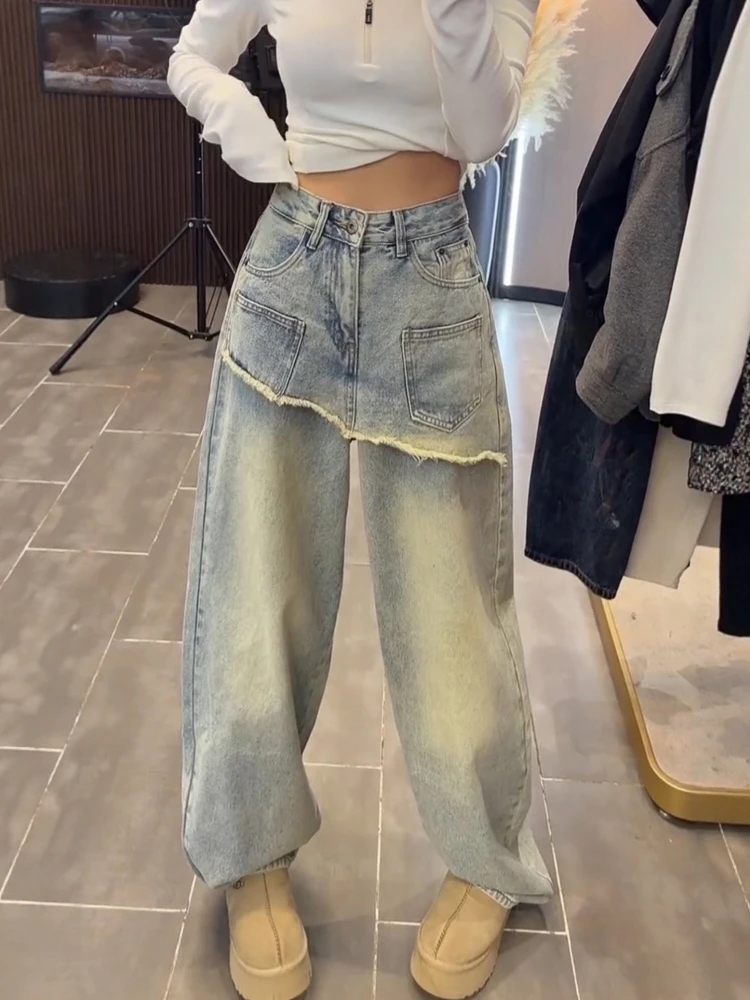 Design sense wide leg jeans women 2026 new spring loose straight leg fake two-piece fart curtain high waist fashion pants