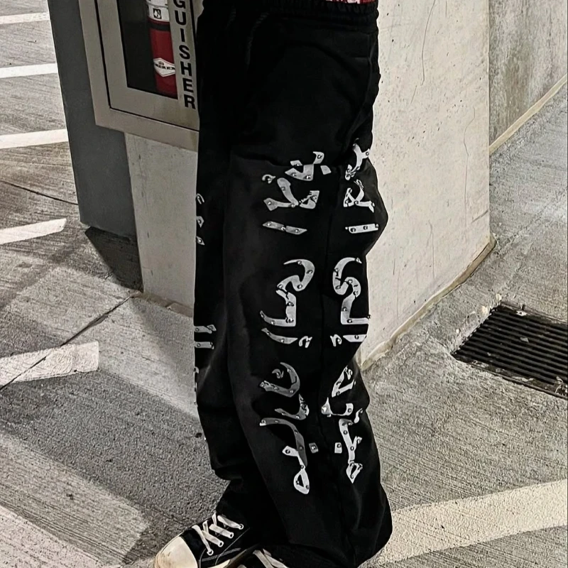 Design de nicho de rua, tendência da moda, calças casuais com estampa de letras versáteis calças de outono e inverno calças de chão de tijolo quente