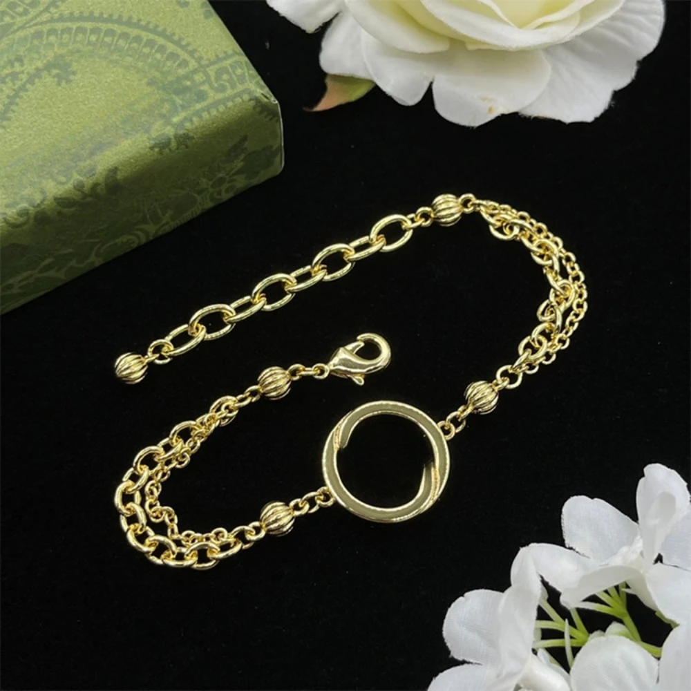 

Классический браслет G в стиле ретро — сверкающее украшение со стразами, толстая потертая цепочка и украшение в виде камелии