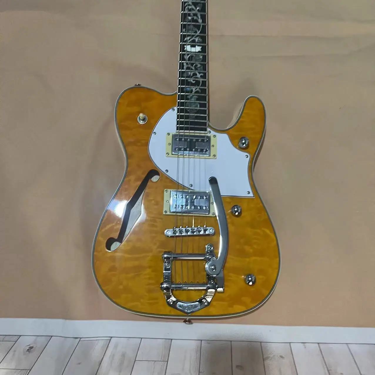 In stock, 6-chord two side f-hole semi hollow electric guitar, with a natural wood color body and gold accessories, available in