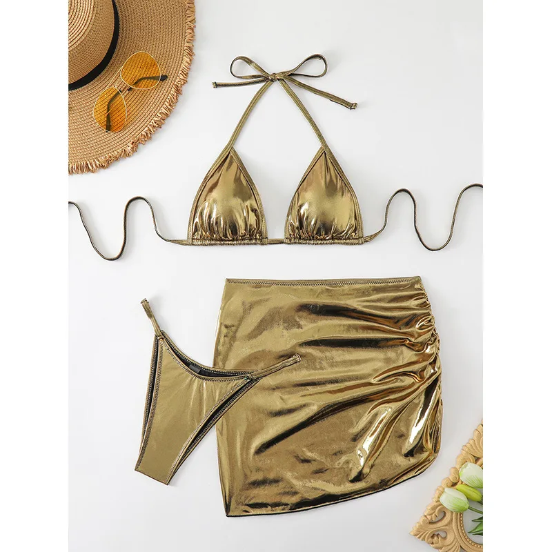 

Новый комплект из 3-х предметов, женский купальник-стринги, сексуальный комплект микро-бикини с юбкой-саронг, металлическая золотая пляжная одежда, купальный костюм