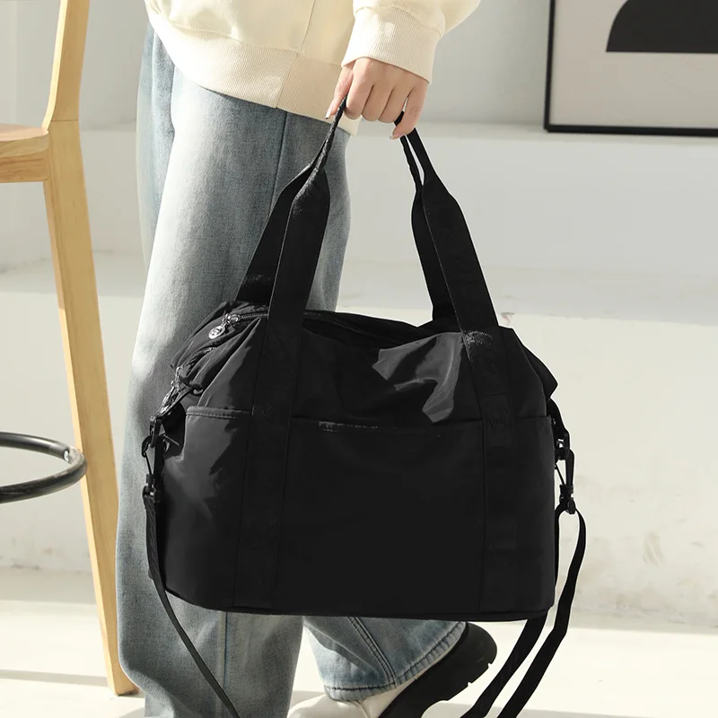 Travel bag large capacity portable lightweight waterproof luggage short-distance travel boarding bags just yet storage bag.