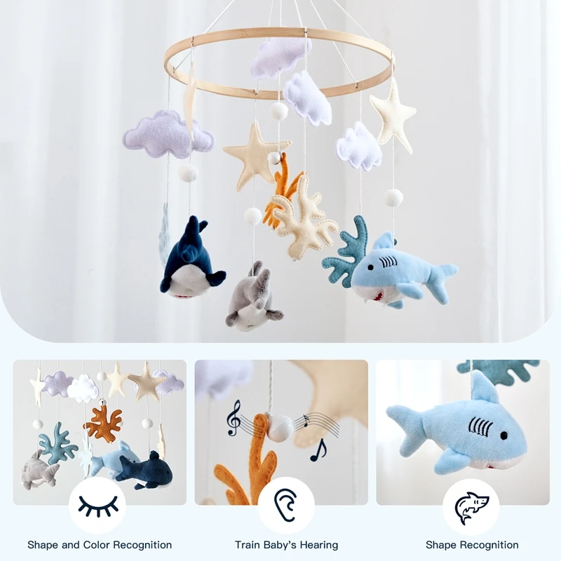 ตาปลาฉลามกลมของเด็กมอนเตสซอรี่มีเสน่ห์น่ารัก และจี้ปลาและปลาดาวขนาดเล็กที่แขวนมีสีสันสดใส